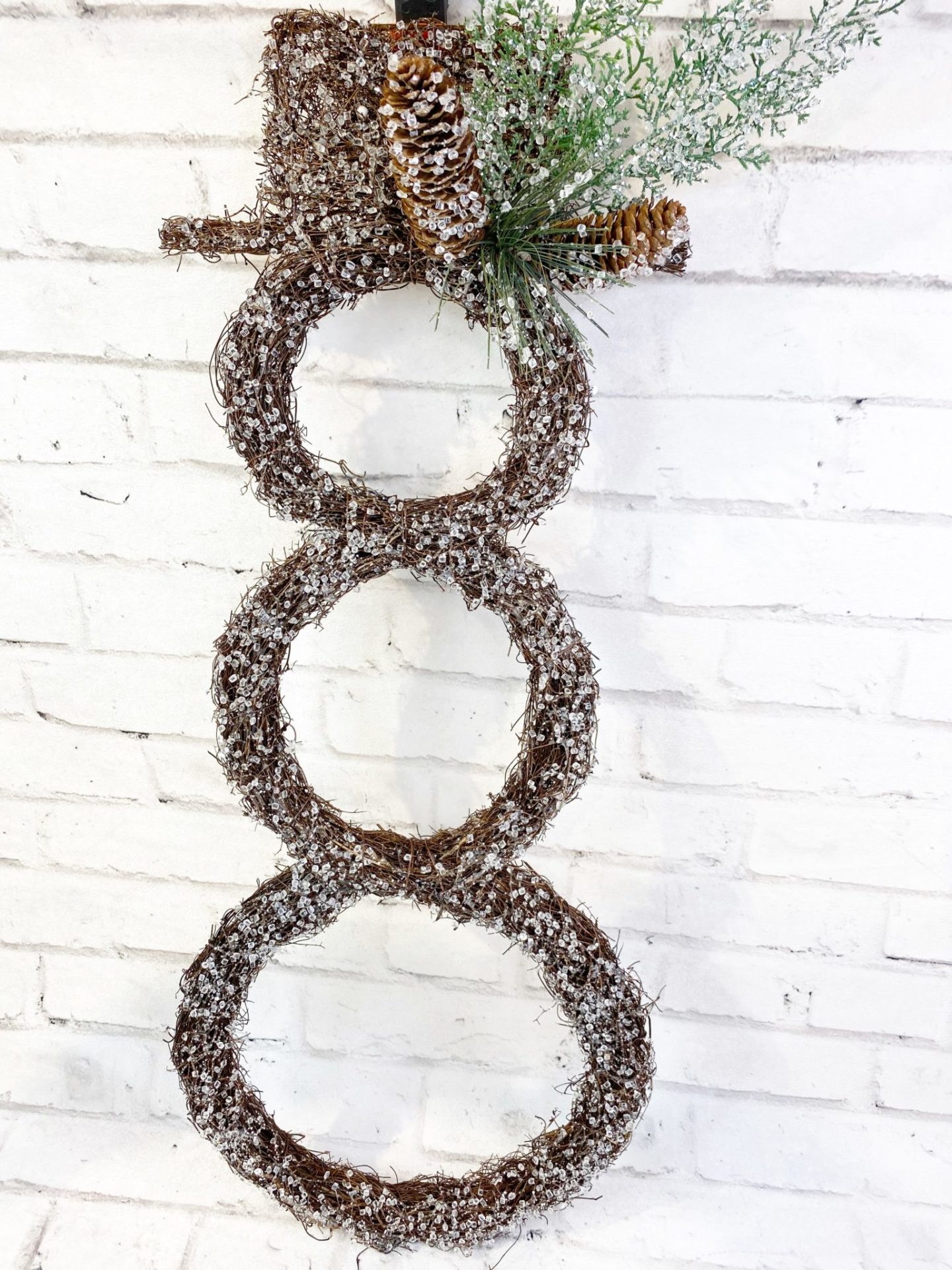 twig snowman with fake frost