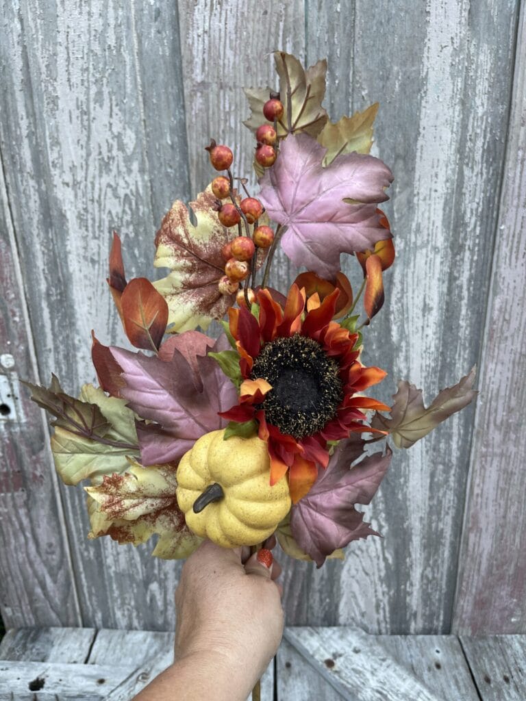 Designer fall stem with layered greenery berries sunflowers and natural texture