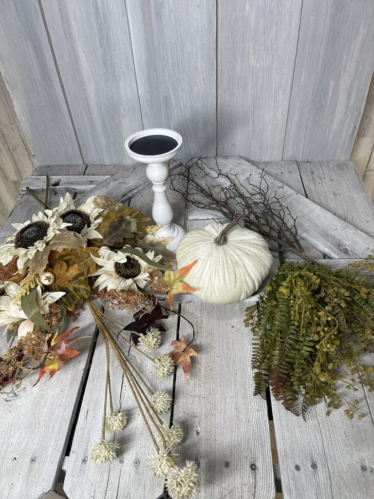 Supplies for velvet pumpkin candlestick centerpiece with sunflower sprays and fall greenery