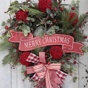 Red and white Christmas wreath with gingham and striped bow