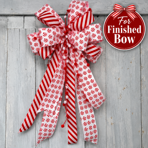 Handmade red and white peppermint Christmas bow with candy cane striped ribbon, pom pom accents, and long tails